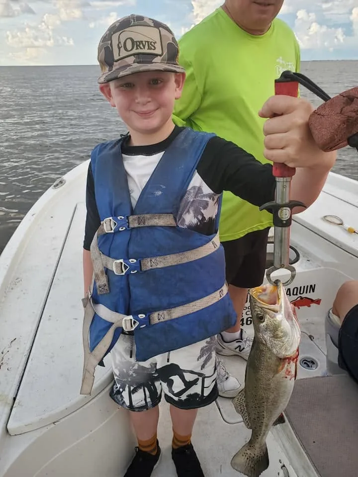 Young angler holding a fish